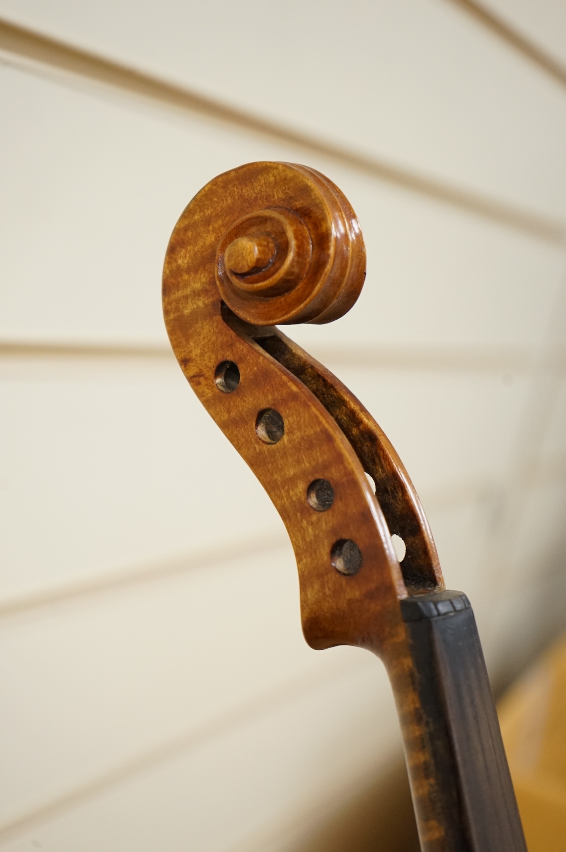 Four violins; a German Dresden violin, together with further two German violins, and a Saxony violin, three in cases or the remains of cases.